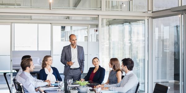 A business leader talking to their executive team.